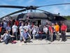 Scouts in front of 1st Battalion of the 150th Air Support Group Army National Guard Black Hawk helicopter