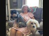 Joyce Kleff cuddles up to Lily (left) and Sophie (right), the first rescue dog adopted from ODHS. ODHS rescued Sophie from living in a shed throughout the seasons. 