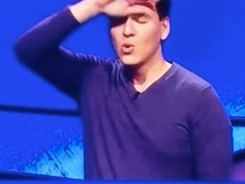 James Holzhauer wipes his brow in relief after a close game. 