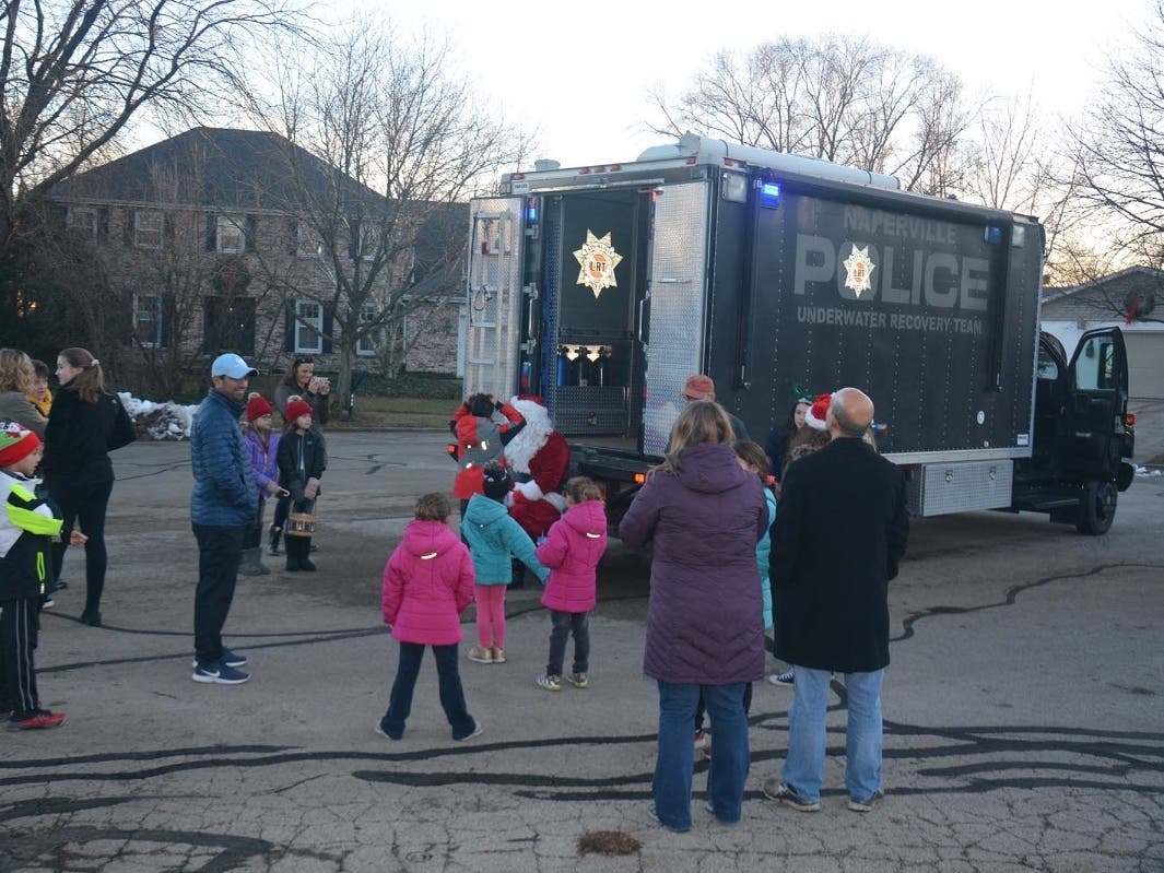 Cops will rev up their underwater recovery vehicle to deliver toys to children in the area. 