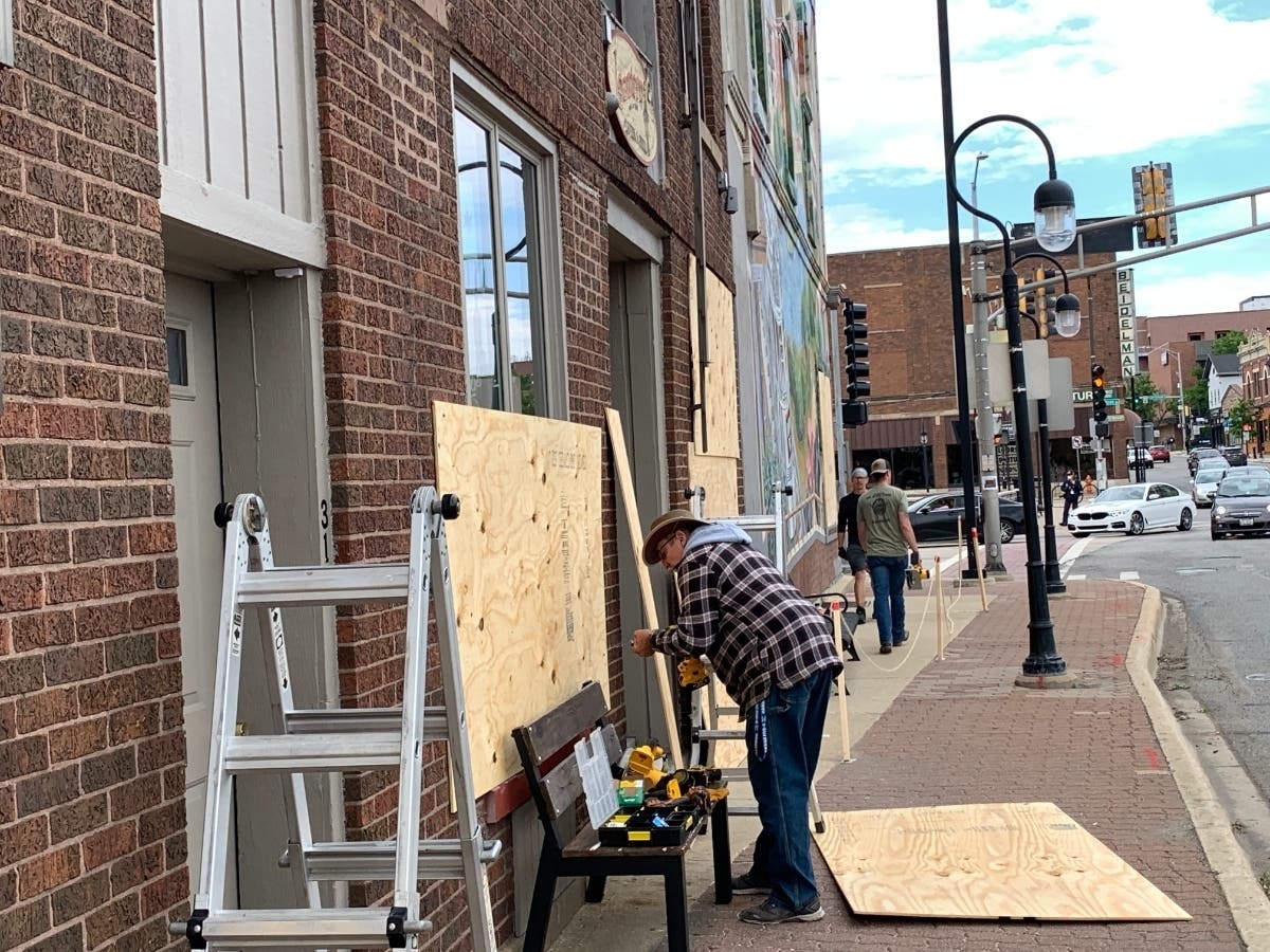 Some businesses in downtown Naperville had boarded up their windows as a precautionary measure, police said. 