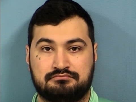 Police say Christian Frazee, 25, approached the Lombard Municipal Complex and squad cars with a bat, a butane lighter and a Molotov cocktail.