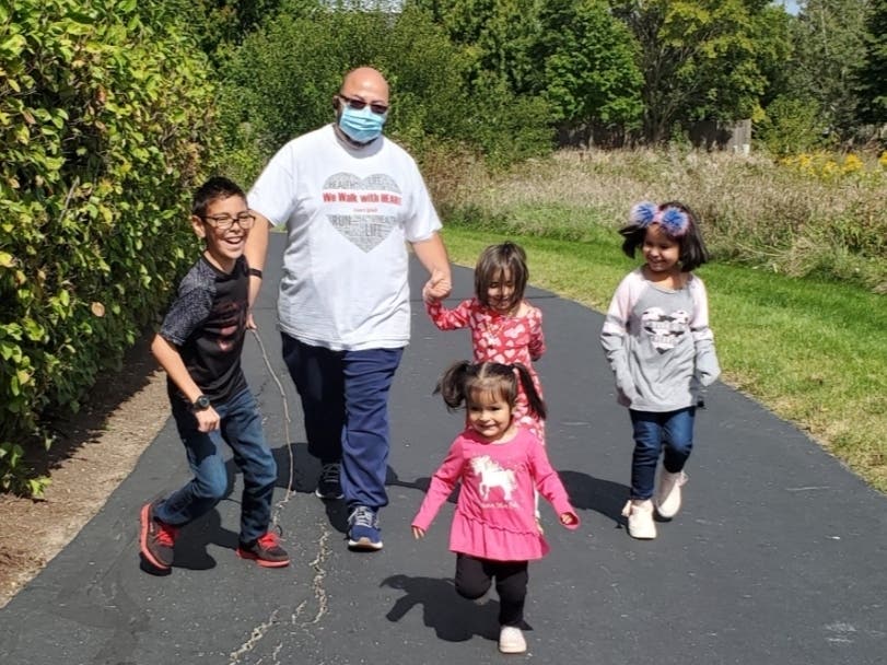 Santos Chaparro walks with some of his grandchildren for the American Heart Association's Heart Walks. 