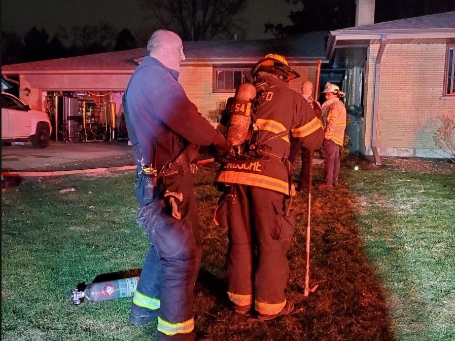 Firefighters battle a blaze in the 22W500 block of Sycamore Drive. 