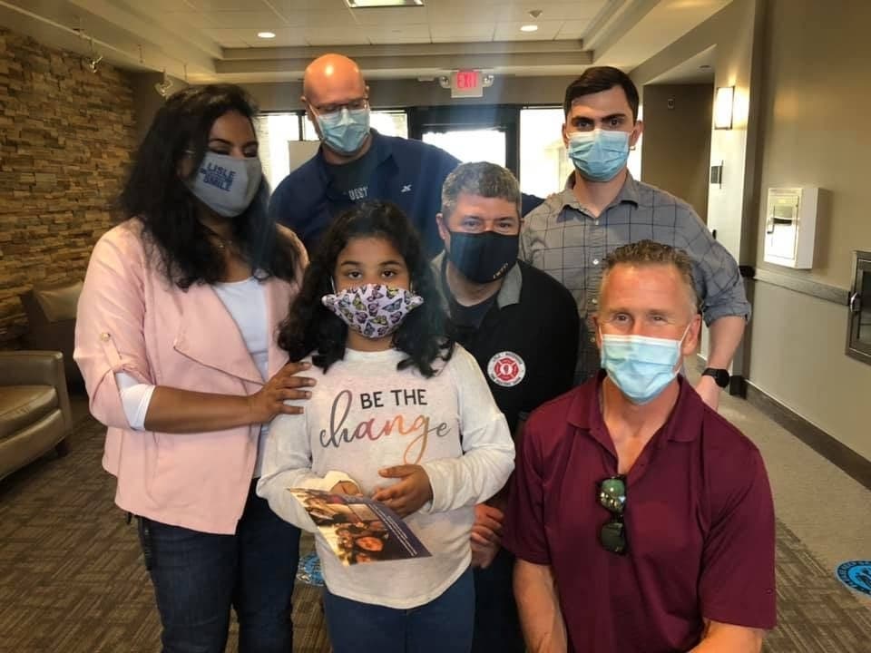 Pictured back row, from left: Sara Sadat, Fire Medic 1st Class Mike Lorence, Fire Medic 1st Class Joe Barnes, Fire Medic 2nd Class Andrew Bednar. Pictured front row, from left: Myra Shaik, Fire Medic 1st Class Mike Rohlicek
