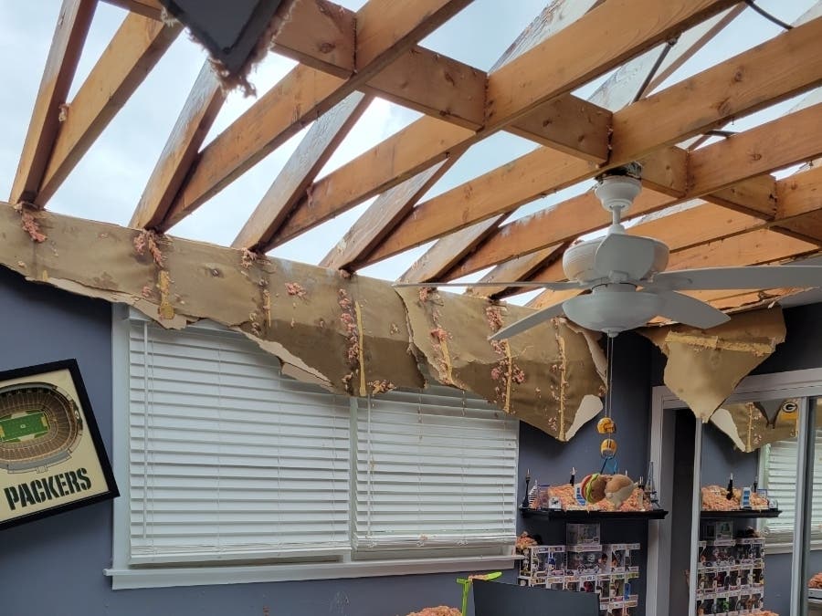 Destructive storms ripped the roof from Trish Axelson's Downers Grove home and caused significant water damage. 