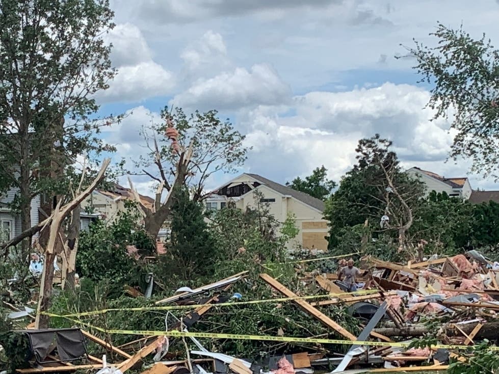 Cleanup continues throughout Woodridge, Naperville and other towns hit by an EF3 tornado on Father's Day. 