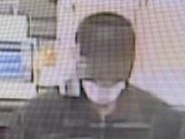 FBI officials say the person pictured in this surveillance image is a suspect in a robbery that took place at BankFinancial, 6301 Fairview Ave., Wednesday. 