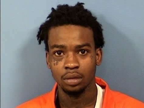Romaine Turner, 21, is being held without bond after he was accused of firing a shot at a Lombard police officer at the 7-Eleven at 1 West St. Charles Rd. 
