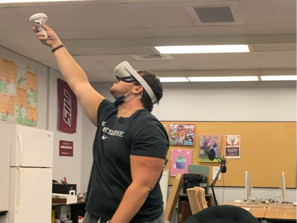 Southern Illinois advertising student and Naperville native Jake Jurinek tests an Oculus virtual reality device in class. Jurinek was one of eight people killed in a crowd surge at the Astroworld Music Festival in Houston Friday. 