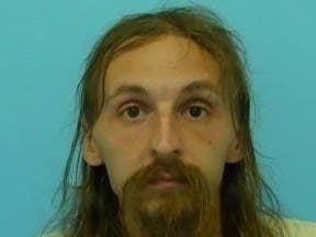 Daniel O’Neill, 35, is accused of threatening two employees with a machete at an apartment building in Naperville.