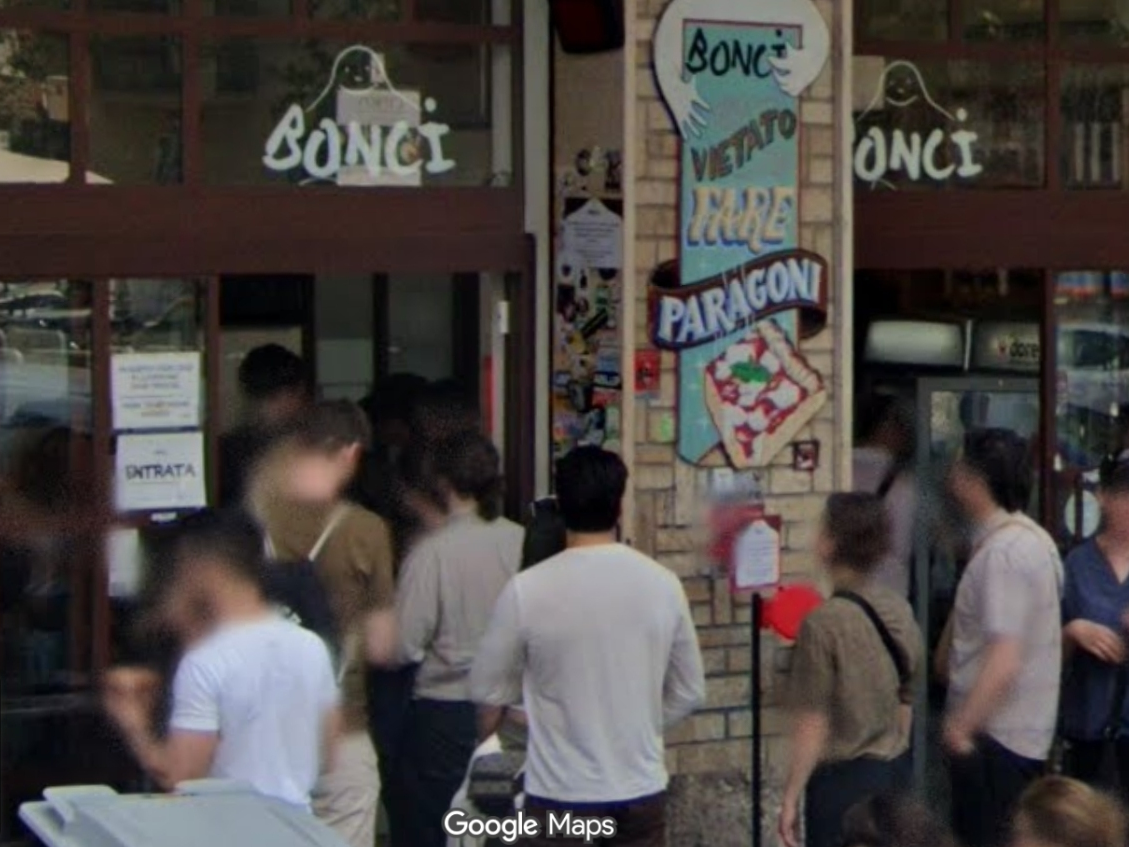 Customers gather outside Bonci Pizza in Rome. The Naperville Bonci Pizza is the first to open outside of Rome or Chicago. 