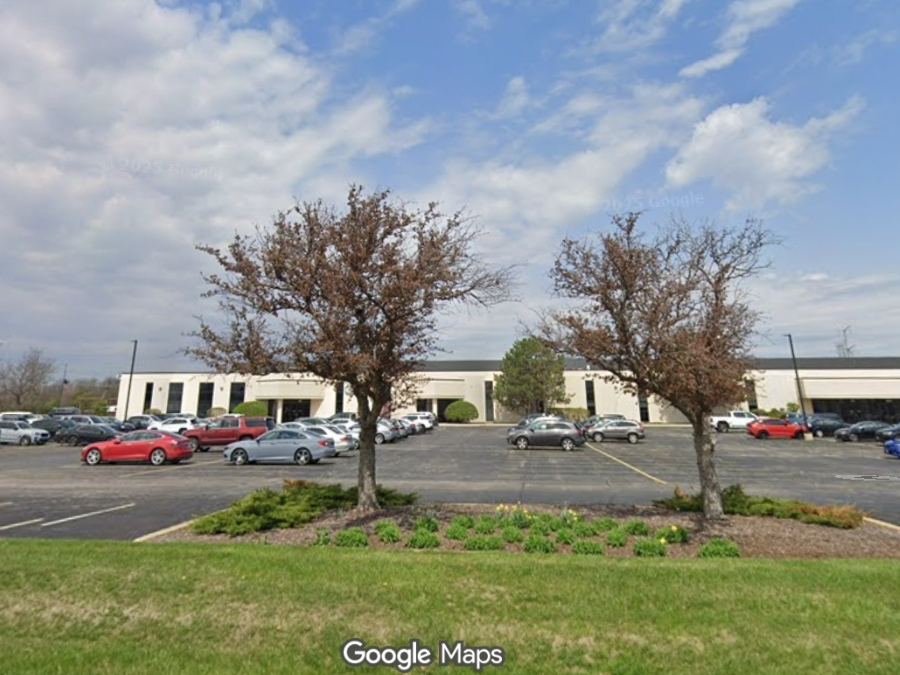 The village will vote Tuesday on a proposal to build a 173,000 square foot building with loading docks at Warrenville Road and Cross Street.