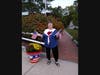 Local Artist Cindy Prevett stands beside one of the painted planters in Oakdale Square. Cindy did the design and artwork on both planters.