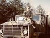 Marine Jessica Adams on top of an M-923 5 ton 6x6 truck.  