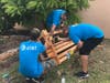 AT&T employees build a bench for the gardens at Kelsey L. Pharr Elementary School