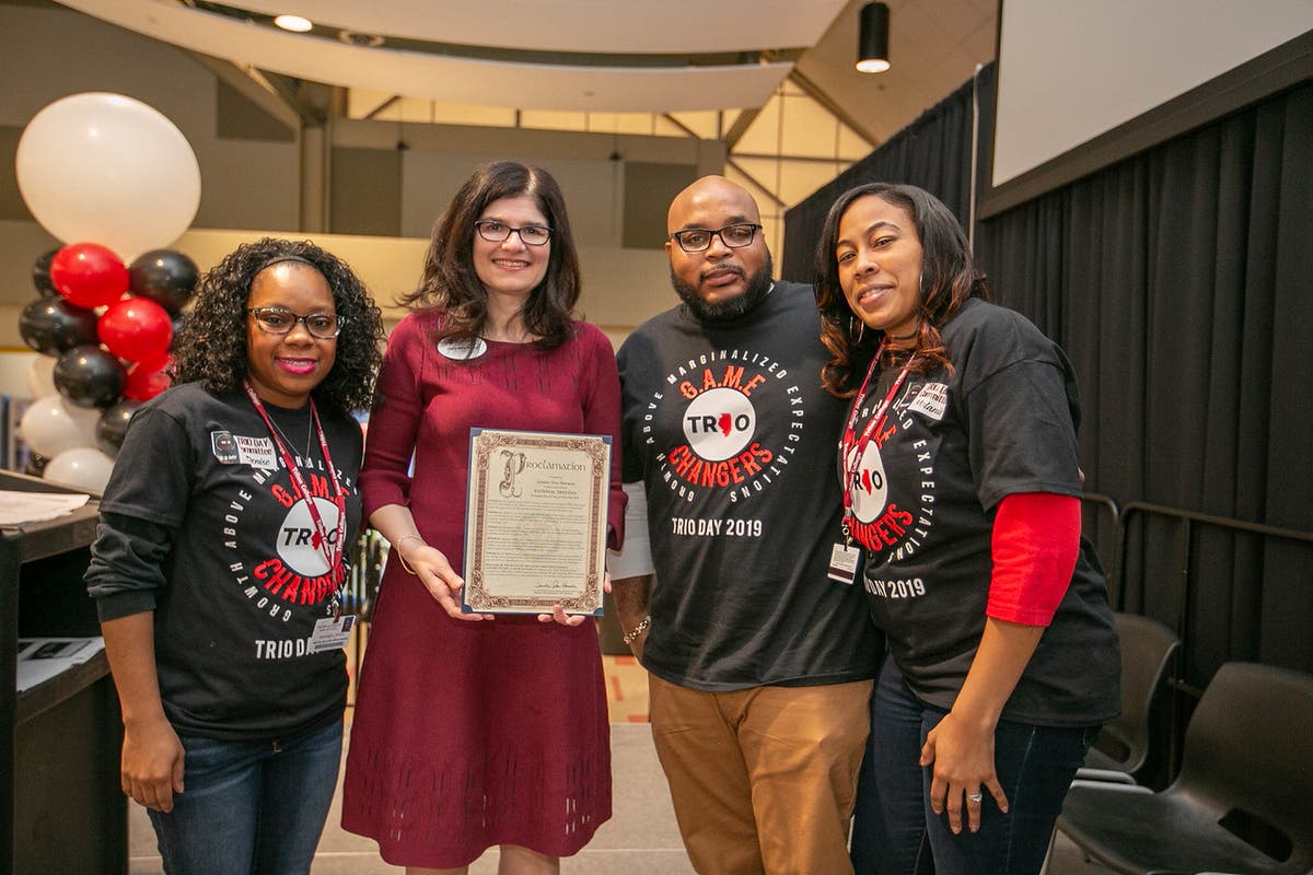 (left to right)  Denise Jones, Triton President Mary-Rita Moore, DeAndre Butler and Melanie Olivera-Jones