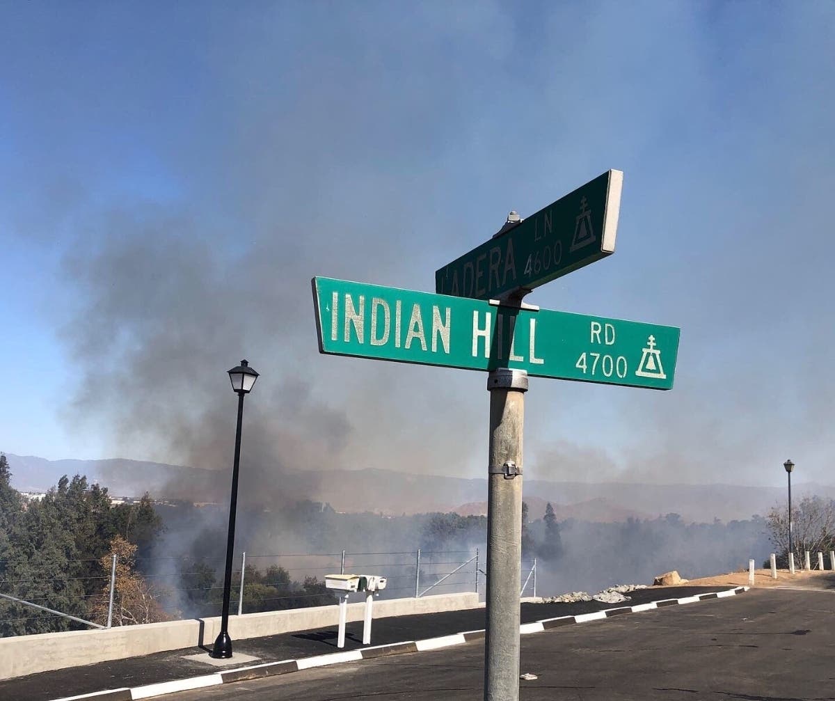 The Dexter Fire in the Santa Ana River bottom was partially contained after threatening numerous homes Wednesday afternoon.