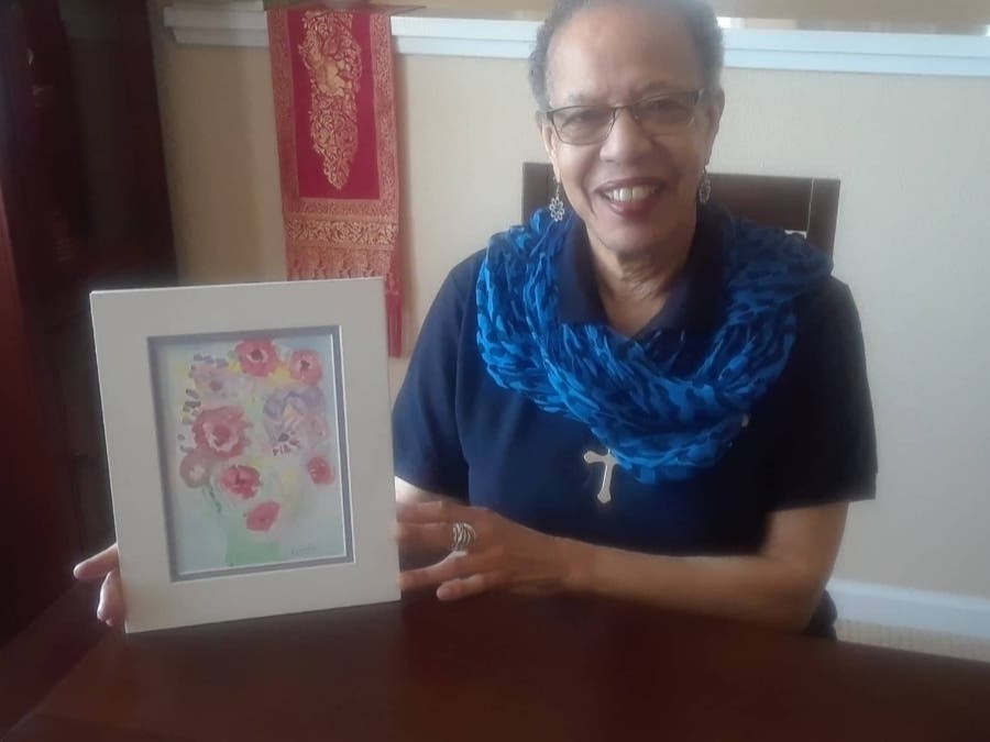 Lureta Johnson and her artwork from adult day care center Live Oak Adult Day Services.