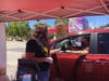 Cars were lined up 15-20 deep at three booths for giant corndogs, funnel cake, candy apples and more at the Veterans' Memorial Auditorium parking lot Saturday in San Rafael.