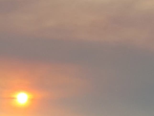 Air district officials issued an air quality advisory for Monday as haze and smoke from wildfires lingers above the Bay Area.