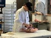 Richard Nichio Jr. Cuts Meat for CrownCafe Customers