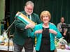 Peter Carroll Gives Mary Ann Doonan her Grand Marshal Jacket