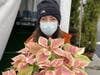 Catherine Gallagher of Fairfield holds one of the magnificent Marble Colored Plants from Vaiuso Farms of Branford for sale at The Castle on Post on December 4, 2021.