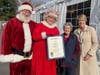 L-R Santa Claus (Brad Baldwin), Mrs. Claus (Colleen Roche), Mrs. Claus's mother (Barbara Roche) and State Rep. Laura Devlin