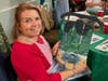 Catherine Austin of Cheshire Displays Her Partially Painted Sled in Support of Ovarian Cancer Patients 