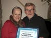Ovarian Cancer Survivor Noreen Forde presents Patrick Clyne, the owner of The Castle on Post Restaurant & Pub in Fairfield, with an award for his volunteer work.  