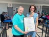 Easton mom Noreen Forde receives a state proclamation from Fairfield State Cristin McCarthy Vahey.