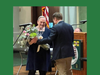 Noreen R. Forde of Easton receives a bouquet of flowers for her volunteer work at the Gaelic American Club