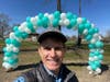 John Brannelly at the Balloon Arch at the 2022 Festival.