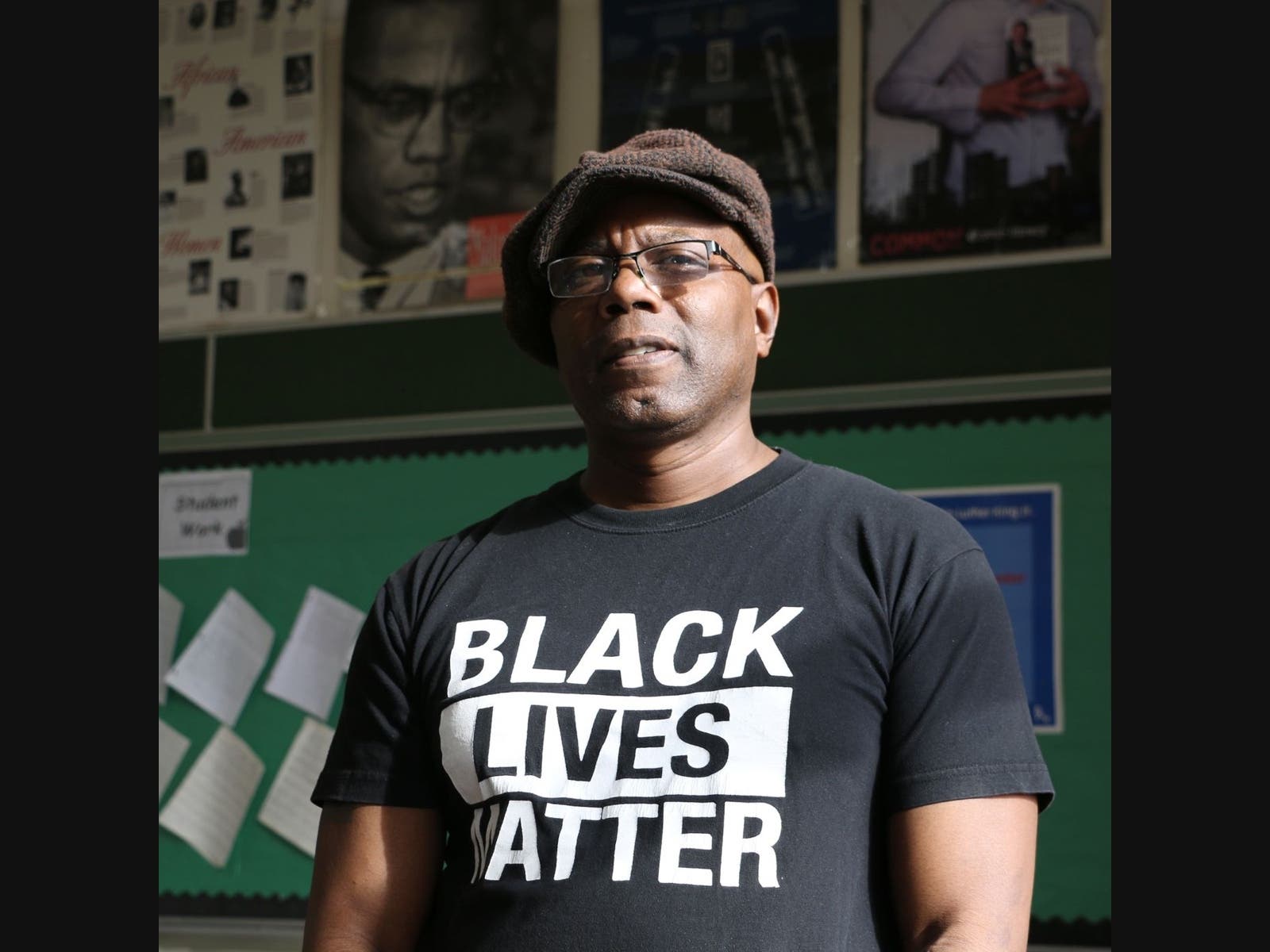 Bashir Muhammad Akinyele standing in his history class at Weequahic High School in Newark, NJ 