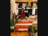 My wife and I standing next to our Kwanzaa display in our home. 