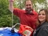 IFP Volunteer, Brian Stellingwerf handing out laundry detergent to the clients at the IFPRC Free Farmer’s Market.