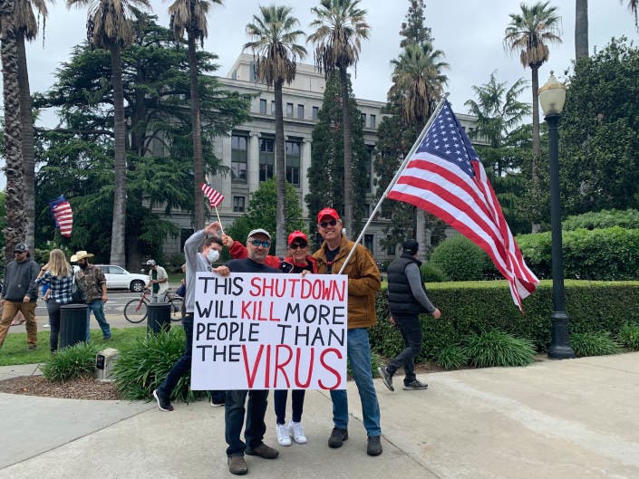 Protesters of California's stay-at-home order gather at the Capitol on Monday, April 20, 2020. 