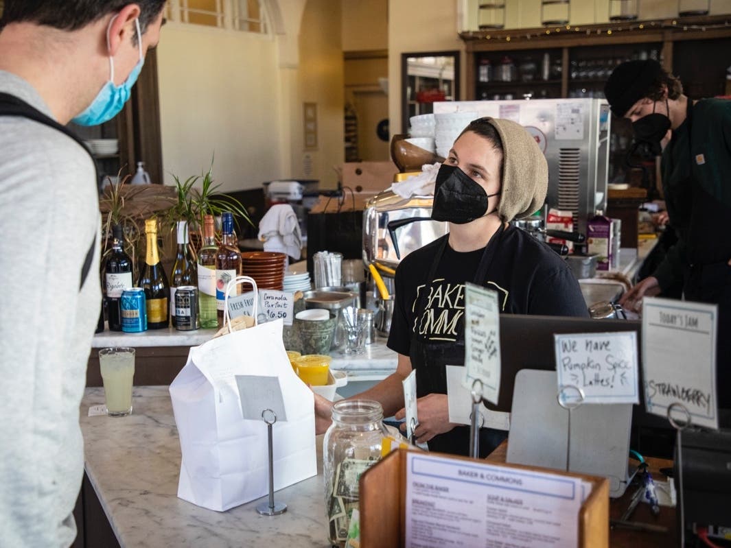 Jaz B. serves a patron at Baker & Commons in Berkeley on Jan. 19, 2022. 