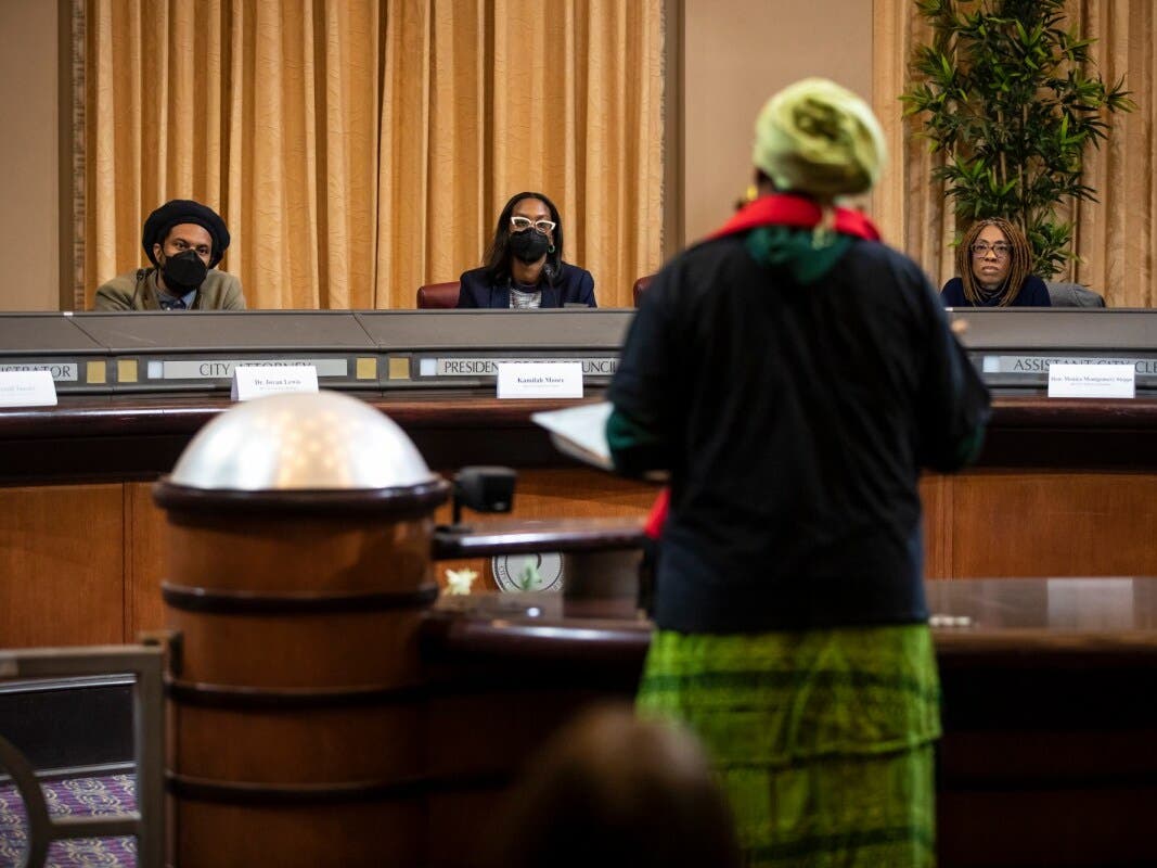 Reparations task force members listen during the public comment portion of a December 14, 2022 meeting in Oakland on reparations proposals for African Americans. Photo by Martin do Nascimento, CalMatters