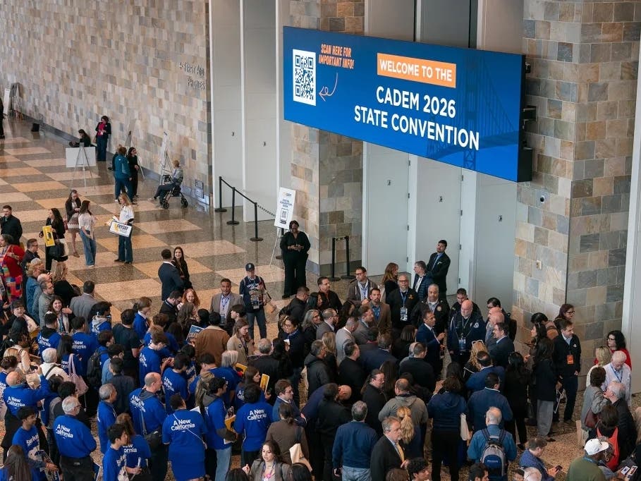 Attendees wait for the opening of the afternoon general session during the California Democratic Party convention at Moscone West in San Francisco on Feb. 21, 2026.