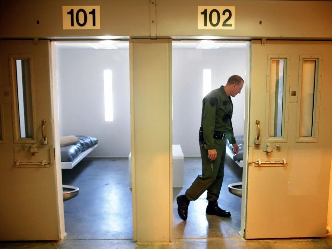 A California correctional lieutenant looks inside a single occupancy cell in Facility C Housing Unit 6 at Salinas Valley State Prison in Soledad on Aug. 27, 2010.