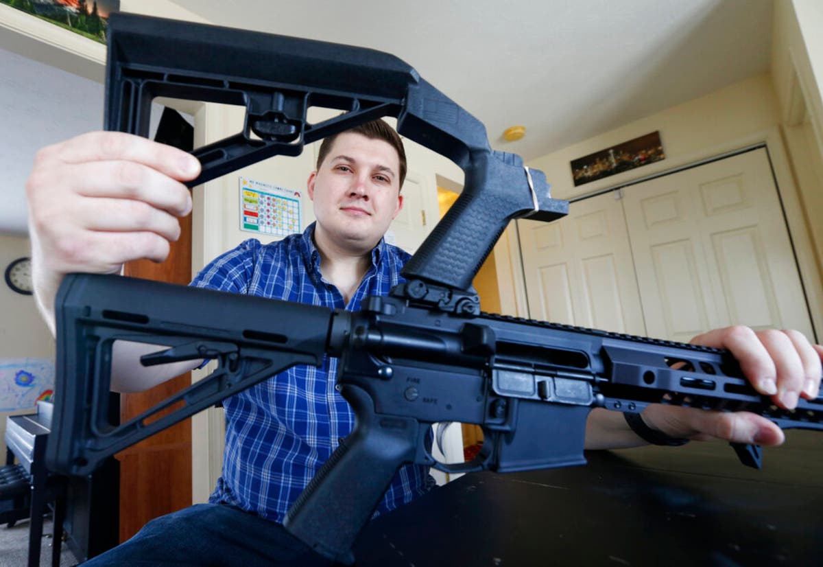 With ban days away, Ryan Liskey, of Harrisonburg, Virginia, is unsure what to do about the bump stock on his AR-15.