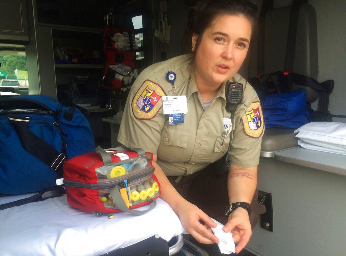 Cabell County, West Virginia, EMT Tabitha Perez demonstrates how medics administer naloxone in opioid overdoses.