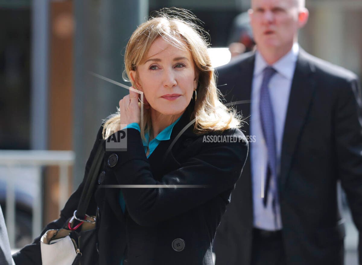 Actress Felicity Huffman arrives at federal court in Boston to face charges in college admissions scandal.