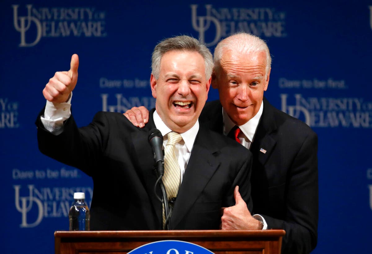 Joe Biden, right, embraces University of Delaware President Dennis Assanis ​at a launch event for the Biden Institute.
