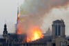Flames rise from Notre Dame cathedral as it burns in Paris, Monday, April 15, 2019.