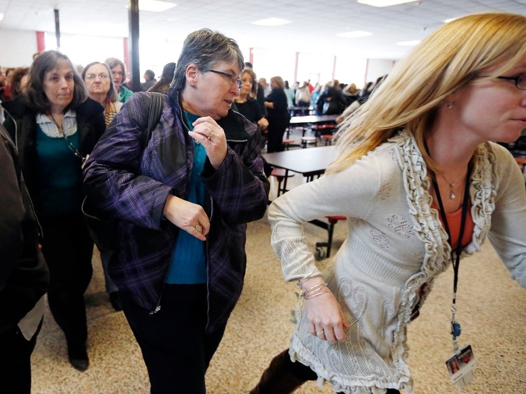 Students at a high school in Milford, Massachusetts, participate in a 2013 training exercise on school shootings.