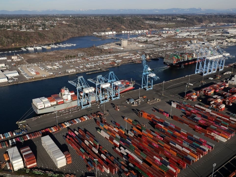 Cargo containers are staged near cranes at the Port of Tacoma, in Tacoma, Washington.