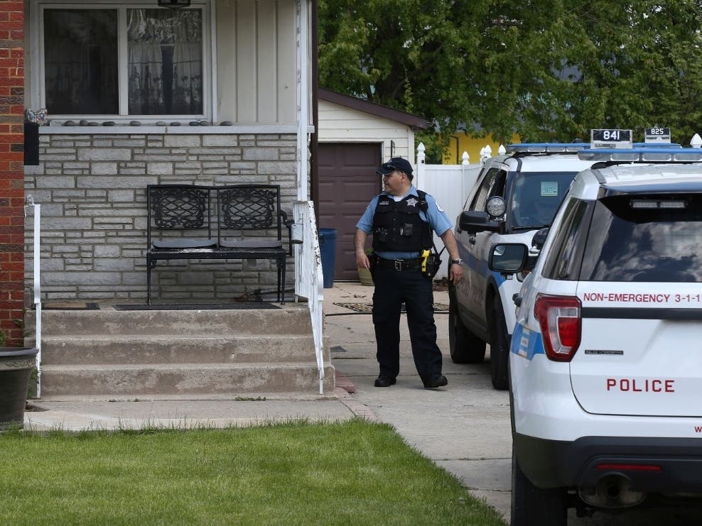 Chicago police watch over a home in Chicago, Wednesday, May 15, 2019, where Marlen Ochoa-Lopez was found strangled.